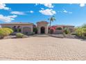 Exterior of a luxurious home with stone accents and landscaping at 36215 N 29Th Ln, Phoenix, AZ 85086