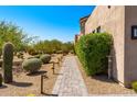 Brick pathway with desert landscaping and lighting at 8742 E Villa Cassandra Dr, Scottsdale, AZ 85266