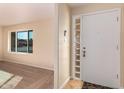 Front entry with glass block windows and neutral colored flooring at 2705 W Summit Pl, Chandler, AZ 85224