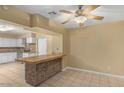 Breakfast bar with a brick-front and tile countertop at 5850 W Cheery Lynn Rd, Phoenix, AZ 85031