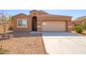 One-story home with a two-car garage and desert landscaping at 727 W Judi Dr, Casa Grande, AZ 85122
