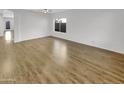 Spacious living room with hardwood floors and plenty of natural light at 11575 W Buchanan St, Avondale, AZ 85323