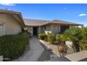 Single story home with walkway leading to front door and well maintained landscaping at 9856 W Rimrock Dr, Peoria, AZ 85382