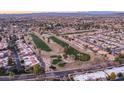 Community overview showcasing homes, landscaping, and a golf course at 9856 W Rimrock Dr, Peoria, AZ 85382