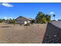 Spacious backyard with gravel and rock landscaping, offering privacy and ample space at 9856 W Rimrock Dr, Peoria, AZ 85382