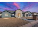 Craftsman style home with a two-car garage, landscaped yard and a welcoming front porch at 3909 S Veronica Ln, Gold Canyon, AZ 85118