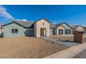 Newly built home with neutral siding and a modern two-car garage at 3909 S Veronica Ln, Gold Canyon, AZ 85118
