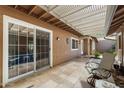 Covered patio with seating area, adjacent to a sliding glass door at 180 Leisure World --, Mesa, AZ 85206