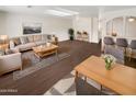 Bright living room with sofa, coffee table, and dining area at 4321 N 50Th Dr, Phoenix, AZ 85031