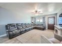 Spacious living room with a large sectional sofa and fireplace at 19608 N 6Th Dr, Phoenix, AZ 85027