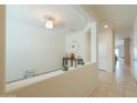 Bright and spacious entryway with high ceilings and a decorative wall at 17078 N Rosemont St, Maricopa, AZ 85138