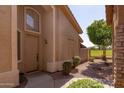 Exterior view of the home's entrance with landscaping at 5415 E Mckellips Rd # 56, Mesa, AZ 85215