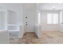 Bright and airy entryway with tile flooring and built-in shelving at 5415 E Mckellips Rd # 56, Mesa, AZ 85215