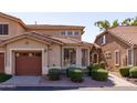 Two story home with attached garage and manicured landscaping at 5415 E Mckellips Rd # 56, Mesa, AZ 85215