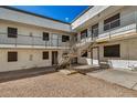 Exterior view of a building with stairs and balconies at 18202 Cave Creek Rd # 111, Phoenix, AZ 85032