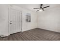 Simple bedroom with white walls, gray flooring, and a ceiling fan at 18202 Cave Creek Rd # 157, Phoenix, AZ 85032
