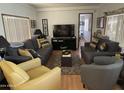 Spacious living room with comfortable seating and hardwood floors at 4065 E University Dr # 300, Mesa, AZ 85205