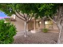 Inviting front entrance with columns and decorative iron door at 17691 N 54Th Ave, Glendale, AZ 85308