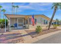 Single-wide manufactured home with landscaped yard at 5402 E Mckellips Rd # 236, Mesa, AZ 85215