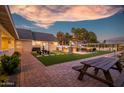 Brick paved patio with fountain and picnic table at 7207 N 175Th Ave, Waddell, AZ 85355