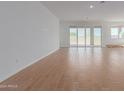 Spacious living area with large sliding doors leading to backyard at 25227 N 131St Dr, Peoria, AZ 85383