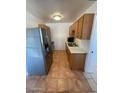 Efficient kitchen features stainless steel appliances and wood cabinets at 4502 W Crittenden Ln, Phoenix, AZ 85031