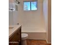 Clean bathroom with a bathtub and updated vanity at 4502 W Crittenden Ln, Phoenix, AZ 85031