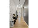 Bright entryway with geometric wall art and modern light fixture at 5725 S 101St St, Mesa, AZ 85212