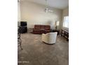 Spacious living room with tile floors and a ceiling fan at 5830 E Mckellips Rd # 62, Mesa, AZ 85215