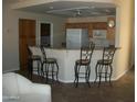 Kitchen with granite countertops and breakfast bar seating at 5830 E Mckellips Rd # 62, Mesa, AZ 85215