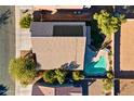 House with solar panels and a swimming pool, aerial view at 1542 E Chaparral Pl, Casa Grande, AZ 85122