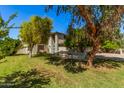 Two-story house with mature landscaping and a spacious yard at 16238 N 65Th Dr, Glendale, AZ 85306