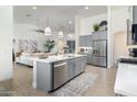 Open concept kitchen with stainless steel appliances and an island at 331 W Dundy St, San Tan Valley, AZ 85143