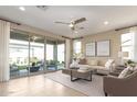 Bright living room featuring sliding glass doors opening to a covered patio at 2076 E Brooklyn Dr, Casa Grande, AZ 85122