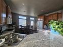 Kitchen with double sink, ample counter space, and wood cabinets at 650 N Hawes Rd # 3820, Mesa, AZ 85207