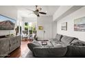 Spacious living room with comfortable seating and a large TV at 4955 E Indian School Rd # 9, Phoenix, AZ 85018