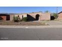 Ranch style home with arched entryway and mature landscaping at 429 W Fairhaven Rd, Kearny, AZ 85137