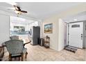 Cozy dining area with wood table and view of the kitchen at 4609 N Miller Rd, Scottsdale, AZ 85251