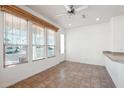 Bright dining area with tile floor and large windows at 7300 N 51St Ave # D212, Glendale, AZ 85301