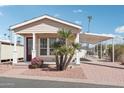 Attractive mobile home with landscaping and carport at 7300 N 51St Ave # D212, Glendale, AZ 85301