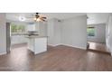 Bright kitchen with island, stainless steel appliances, and white cabinetry at 19826 N 11 St, Phoenix, AZ 85024