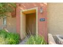 Condo entrance with a brown door and desert landscaping at 2402 E 5Th St # 1429, Tempe, AZ 85288