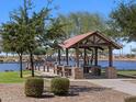 Community features a lakeside gazebo with picnic tables at 36888 W Prado St, Maricopa, AZ 85138