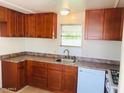 Cozy kitchen with wood cabinets and appliances at 2460 E Main St # A17, Mesa, AZ 85213