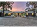 Brick house with a large driveway and gated entry at 39839 N Spur Cross Rd, Cave Creek, AZ 85331