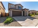 Two-story home with stone accents and a two-car garage at 23095 E Mewes Rd, Queen Creek, AZ 85142