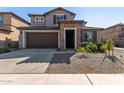 Two-story home with stone accents and a two-car garage at 23095 E Mewes Rd, Queen Creek, AZ 85142