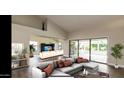 Spacious living room with large sliding doors opening to a patio at 13035 W Ballad W Dr, Sun City West, AZ 85375