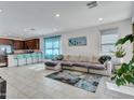 Open living area featuring a comfortable sectional sofa and stylish rug at 24614 N 169Th Dr, Surprise, AZ 85387