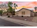 Single story home with a two-car garage and desert landscaping at 1384 E Morelos St, Chandler, AZ 85225